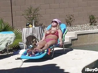 Blonde gets her tits out under the sun