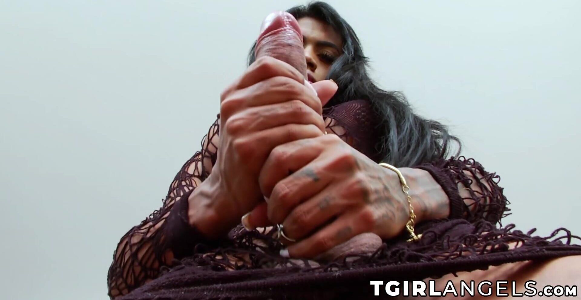Busty trans Sabrina Loppes plays with her big cock and swollen balls